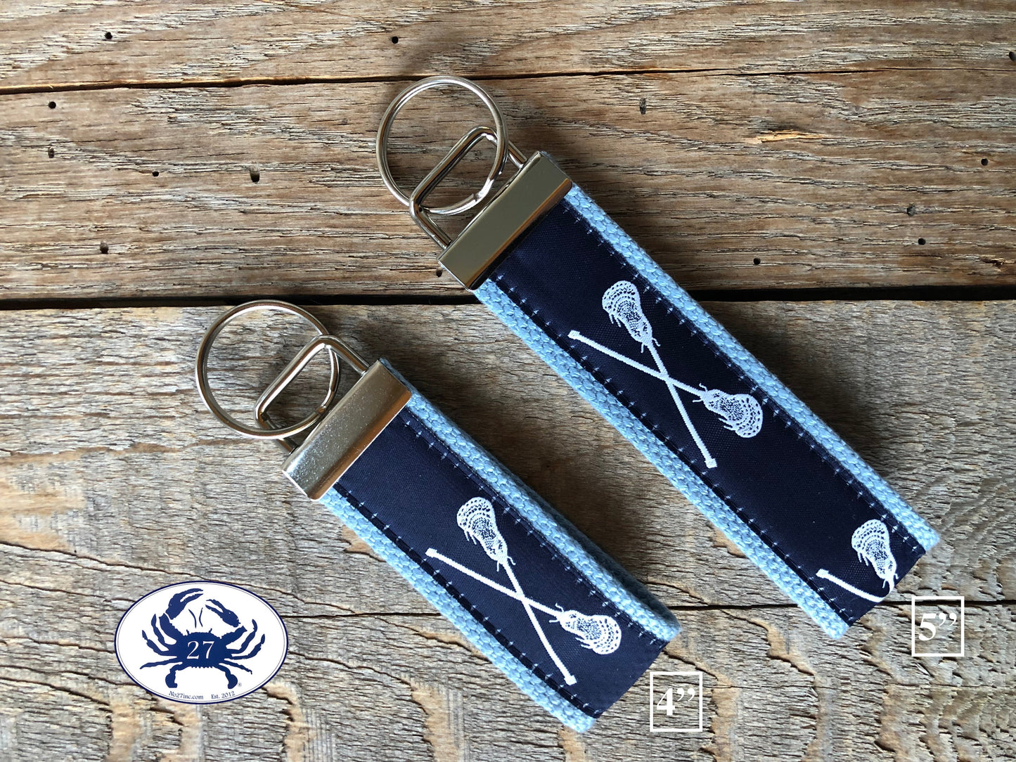 White Lacrosse Sticks on Green Key Chain