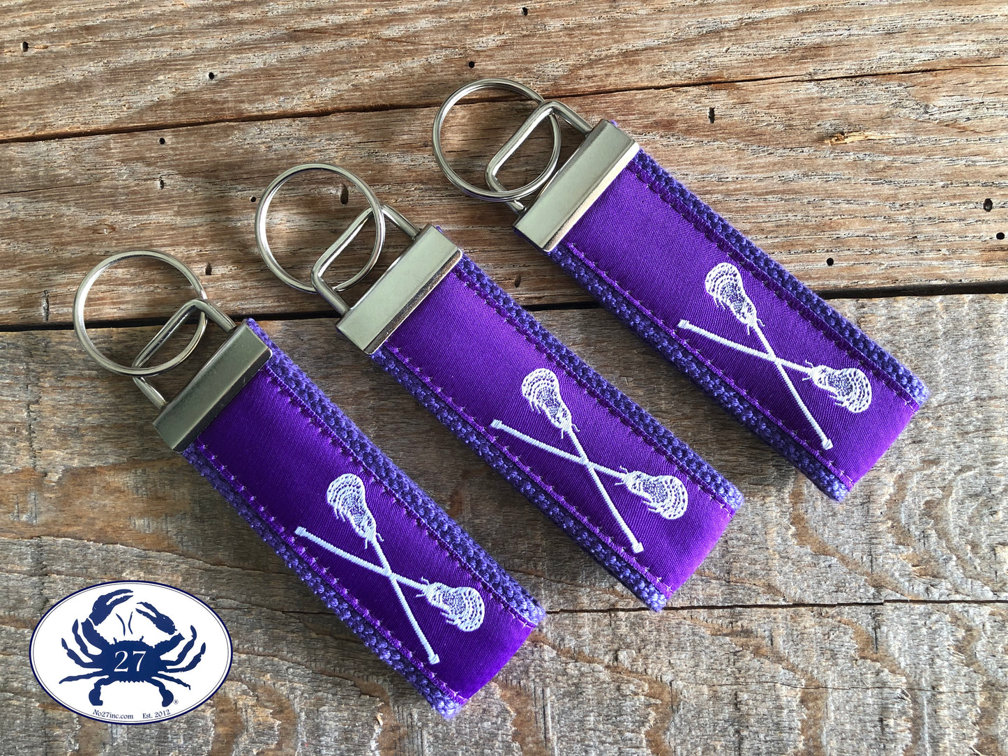 White Lacrosse Sticks on Purple Key Chain