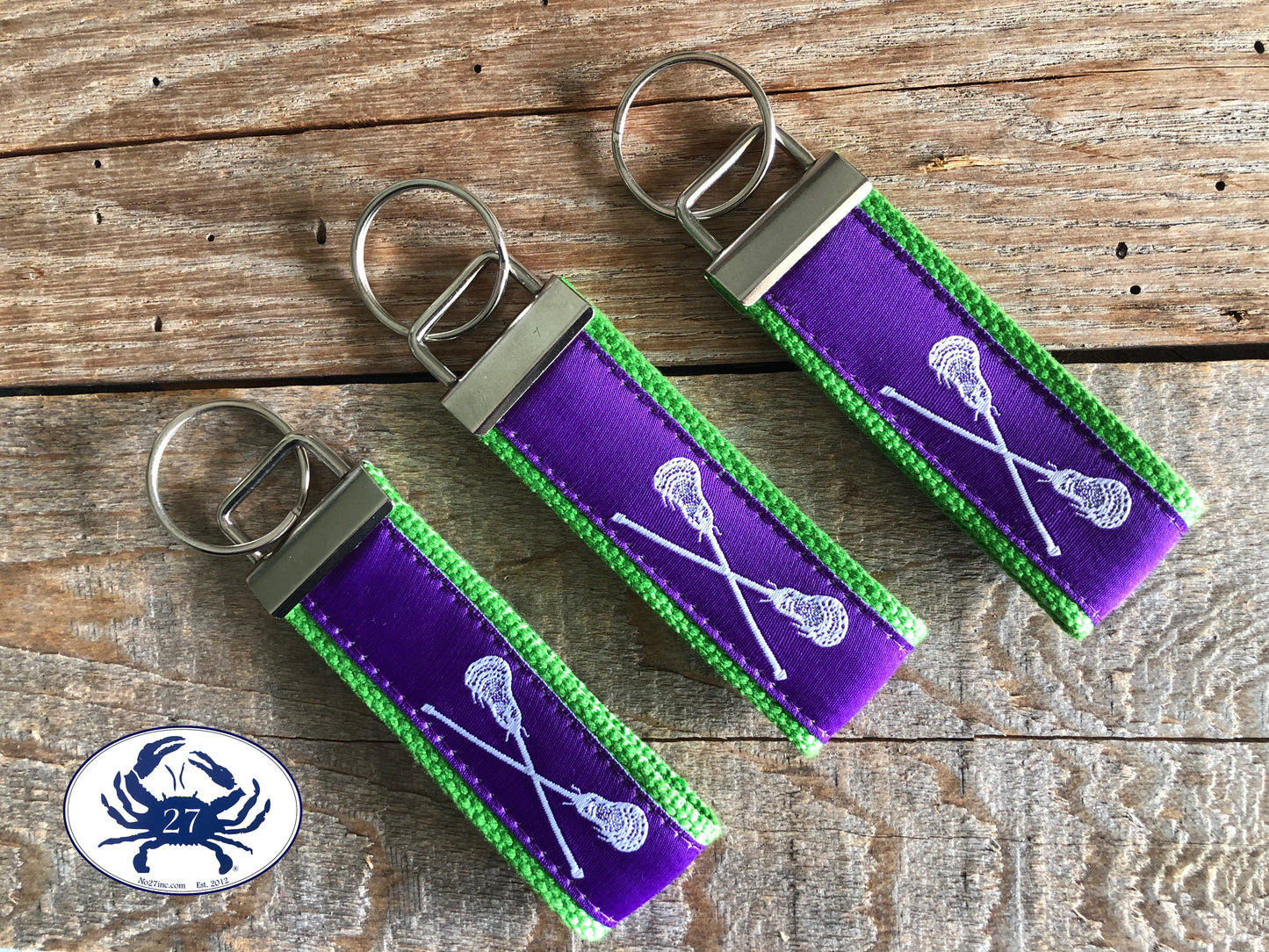 White Lacrosse Sticks on Purple Key Chain