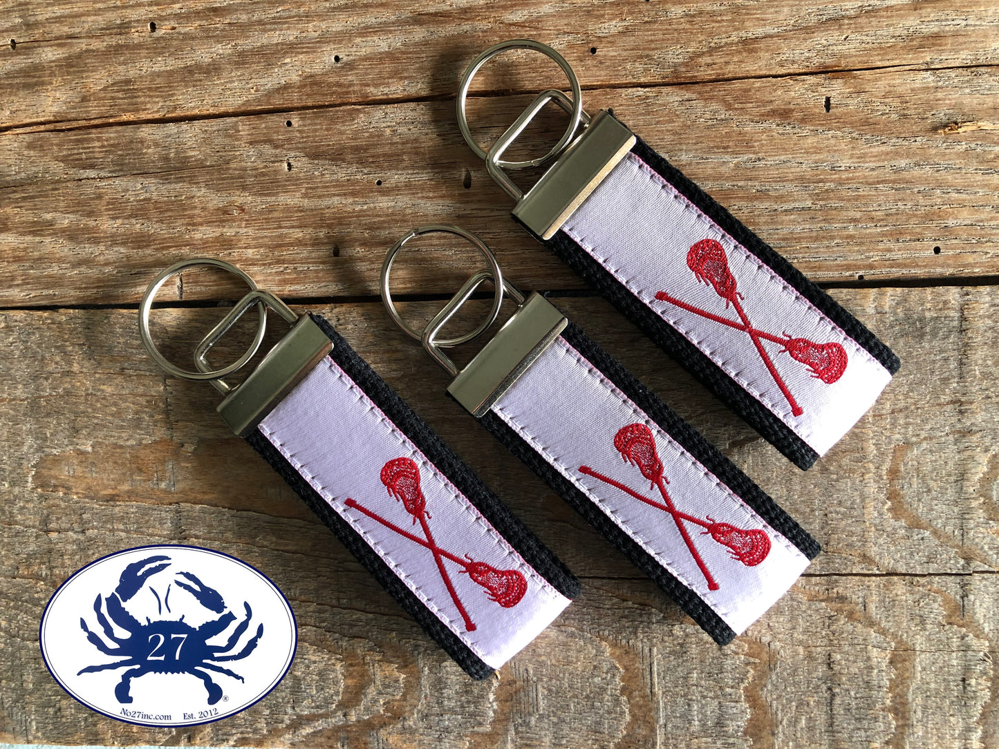 Red Lacrosse Sticks on White Key Chain