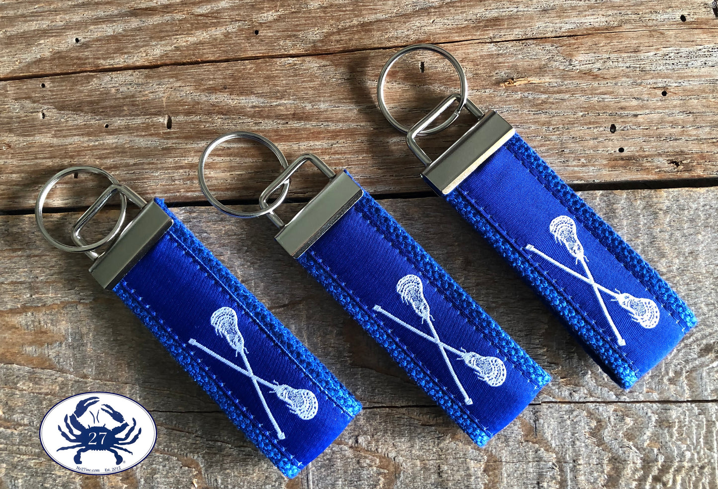 White Lacrosse Sticks on Royal Blue Key Chain