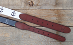 Red, White and Blue Lacrosse Sticks on Carolina Blue Lacrosse Belt