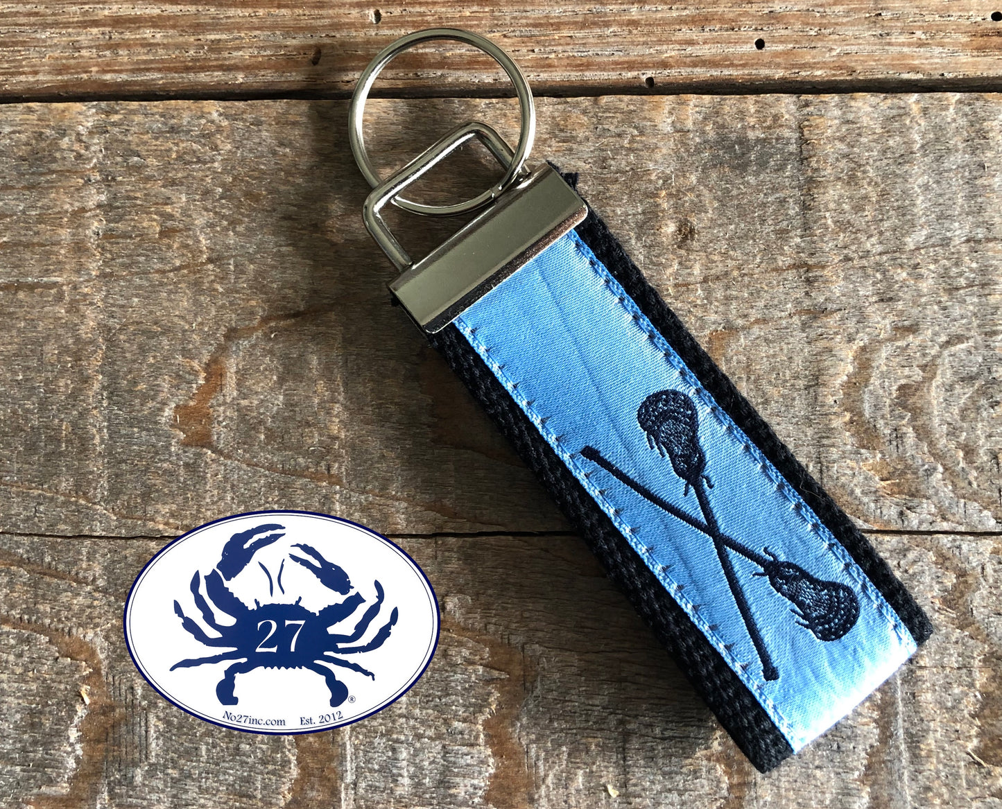 Black Lacrosse Sticks on Carolina Blue Key Chain