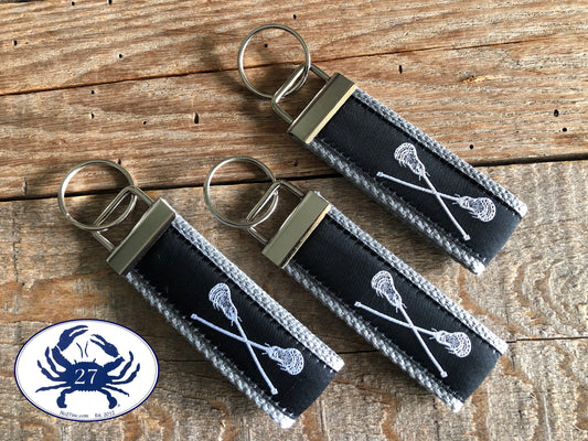 White Lacrosse Sticks on Black Key Chain