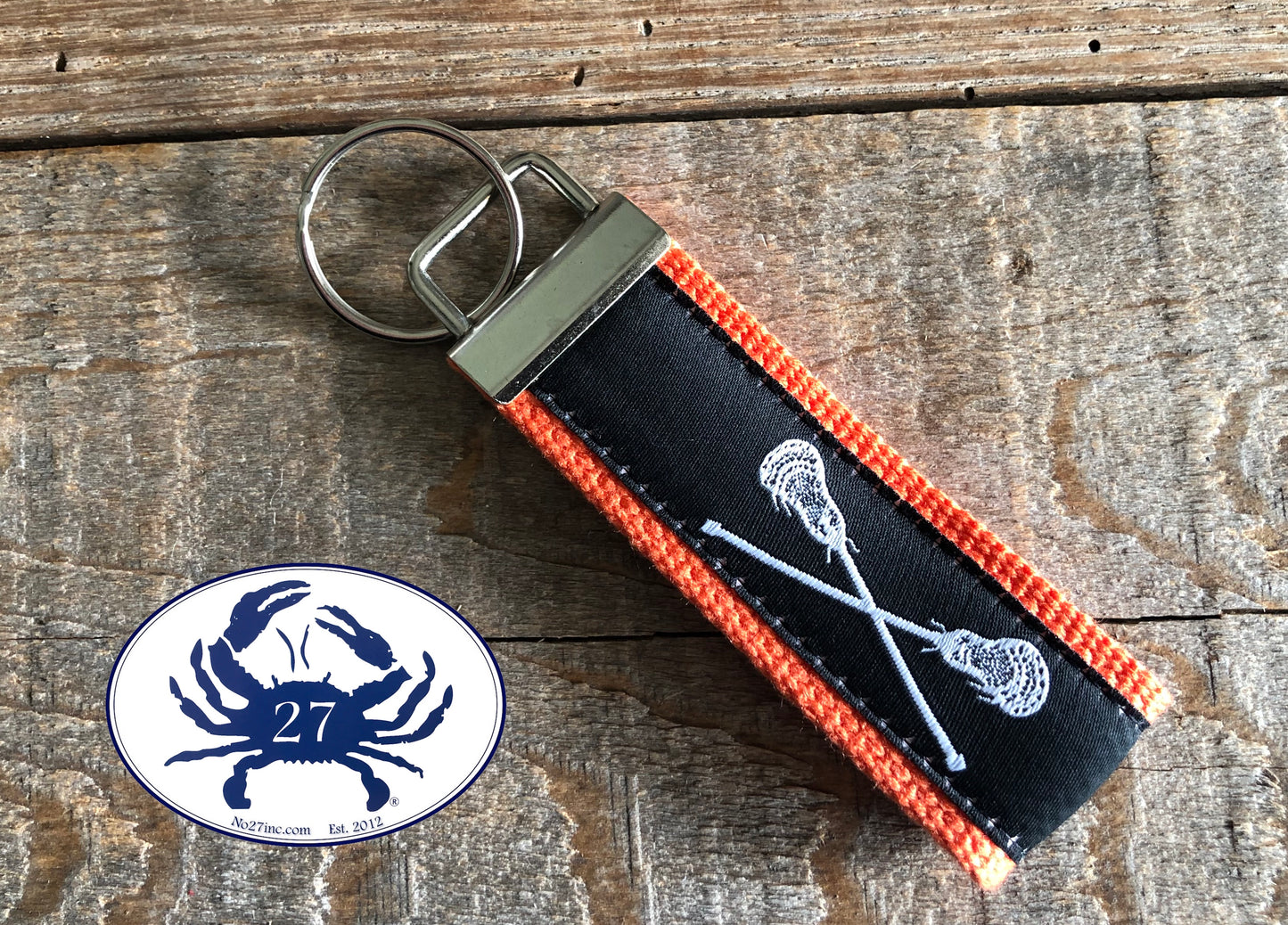 White Lacrosse Sticks on Black Key Chain