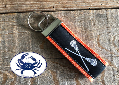 White Lacrosse Sticks on Black Key Chain