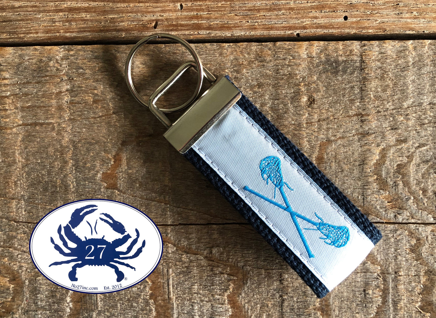 Carolina Blue Lacrosse Sticks on White Key Chain