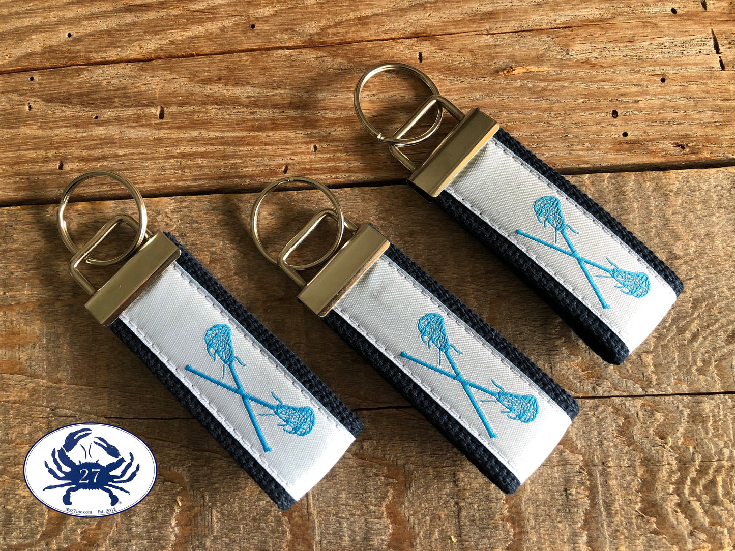 Carolina Blue Lacrosse Sticks on White Key Chain