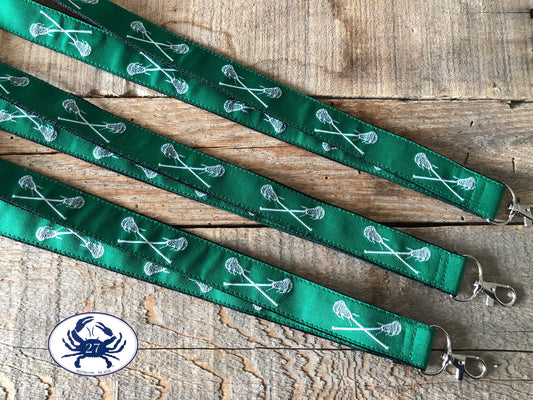 White Lacrosse Sticks on Green Ribbon Lanyard