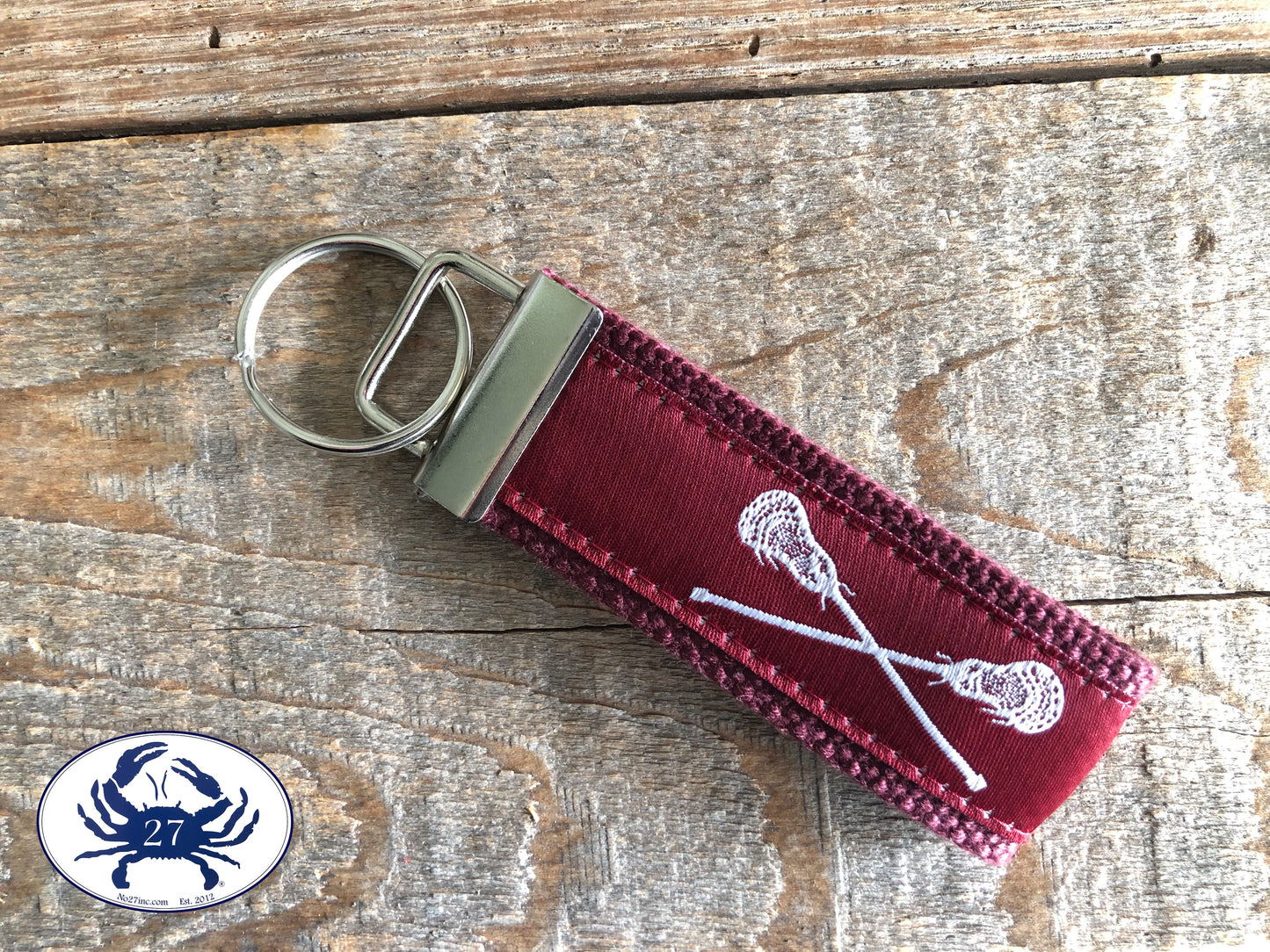 White Lacrosse Sticks on Maroon Key Chain