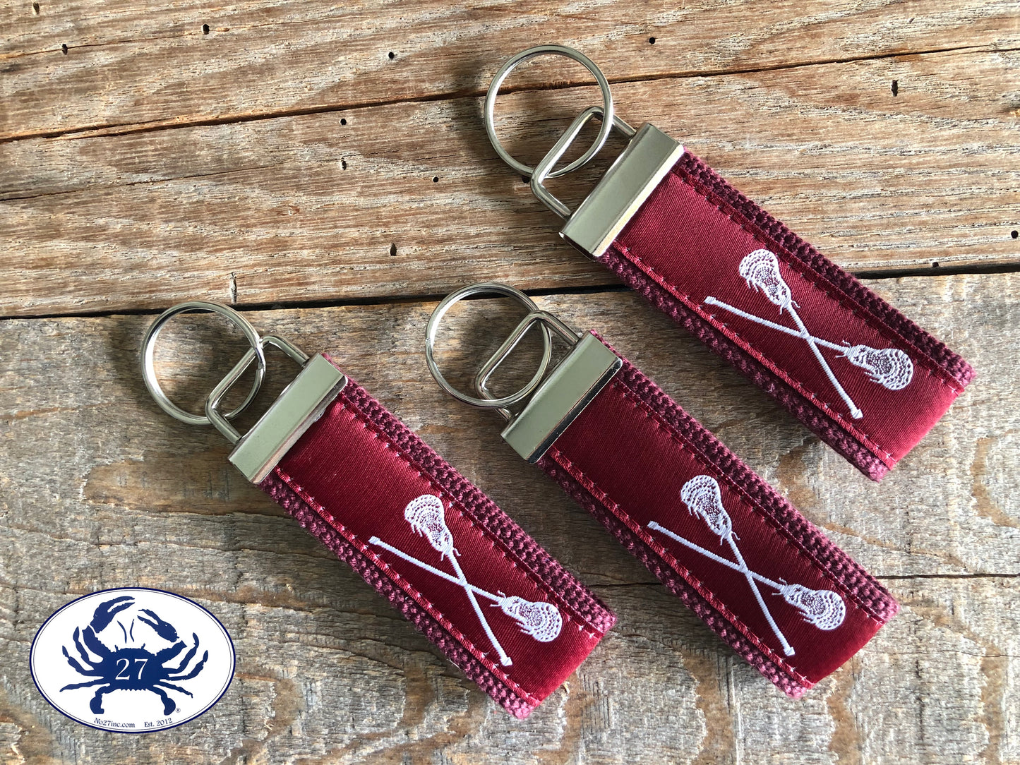 White Lacrosse Sticks on Maroon Key Chain