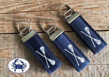White Lacrosse Sticks on Navy Key Chain