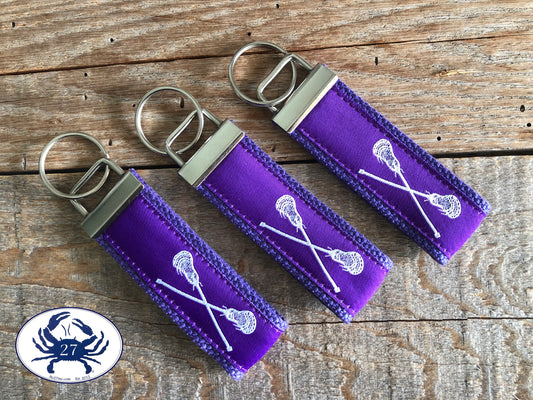 White Lacrosse Sticks on Purple Key Chain