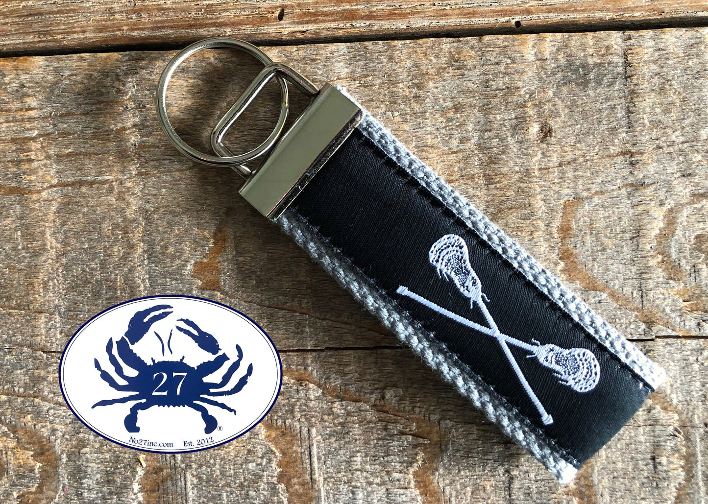 White Lacrosse Sticks on Black Key Chain