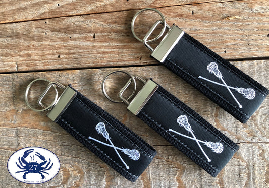 White Lacrosse Sticks on Black Key Chain