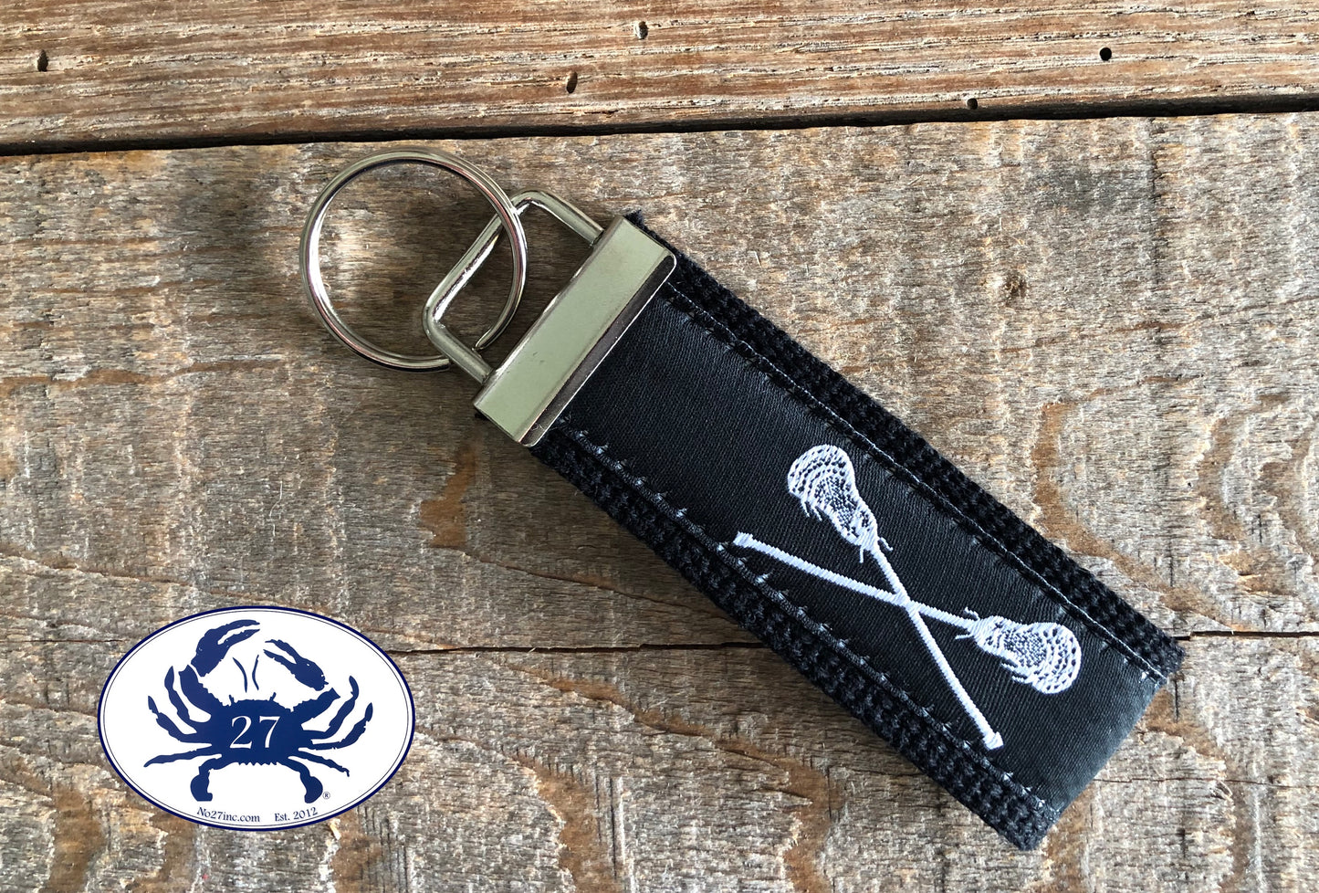 White Lacrosse Sticks on Black Key Chain