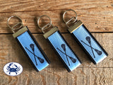 Black Lacrosse Sticks on Carolina Blue Key Chain