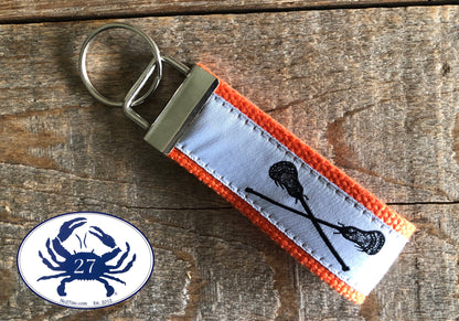 Black Lacrosse Sticks on White Key Chain