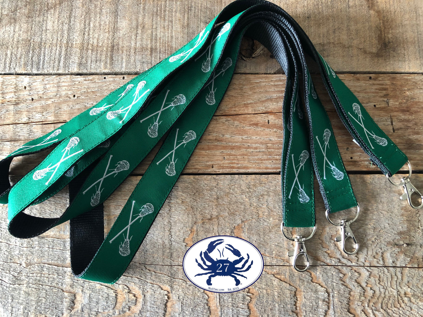 White Lacrosse Sticks on Green Ribbon Lanyard
