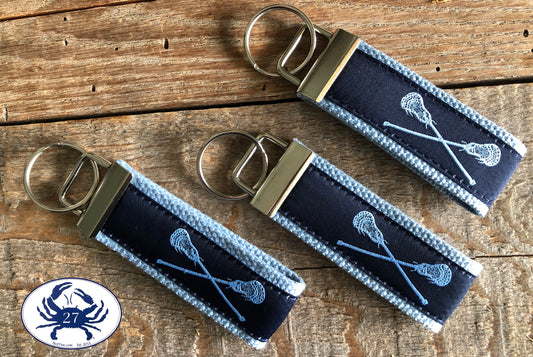 Light Blue Lacrosse Sticks on Navy Blue Key Chain