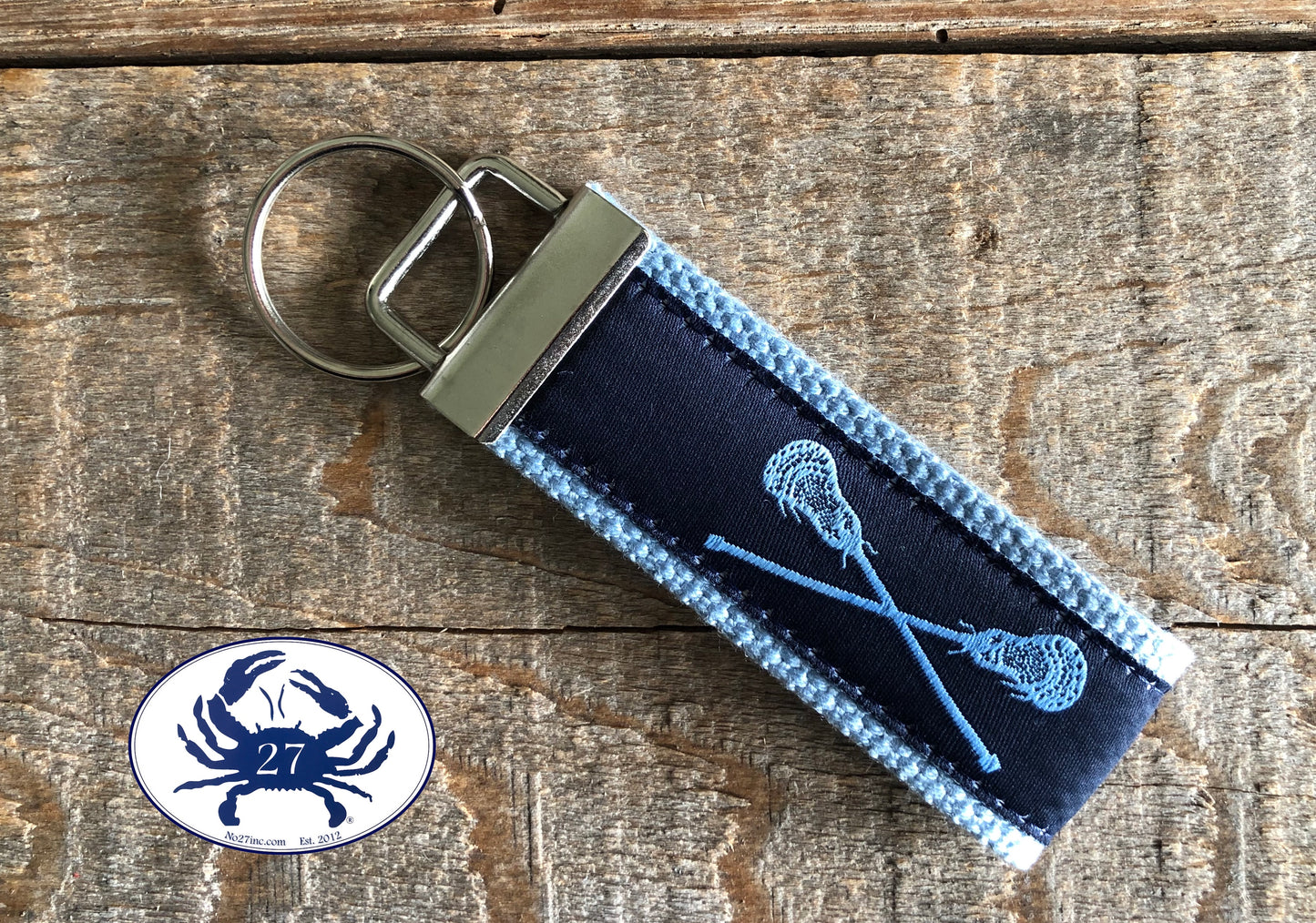Light Blue Lacrosse Sticks on Navy Blue Key Chain