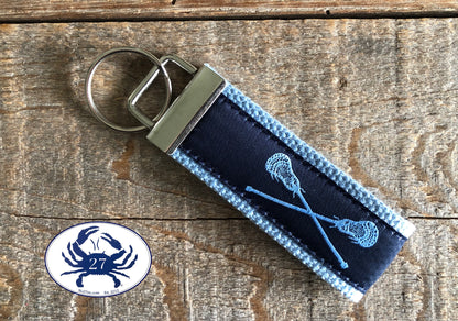 Light Blue Lacrosse Sticks on Navy Blue Key Chain