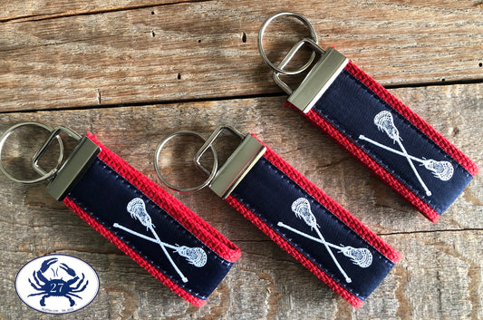 White Lacrosse Sticks on Navy Key Chain