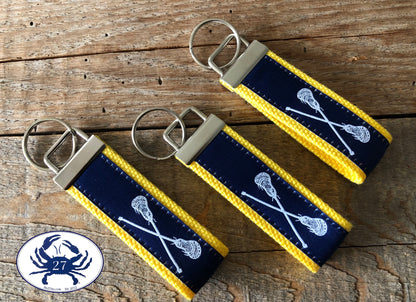 White Lacrosse Sticks on Navy Key Chain