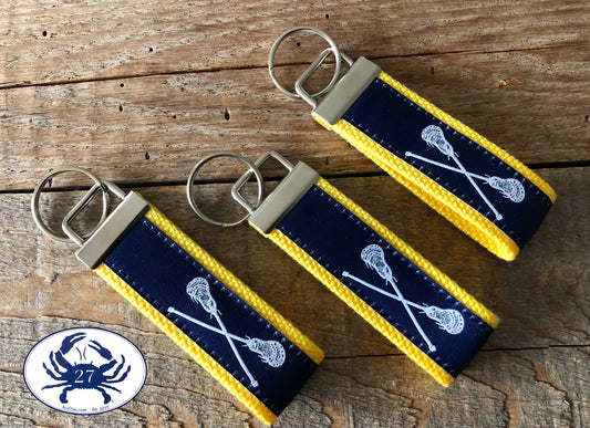 White Lacrosse Sticks on Navy Key Chain