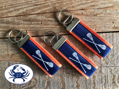 White Lacrosse Sticks on Navy Key Chain