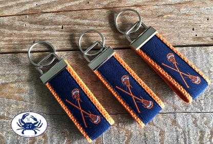 Orange Lacrosse Sticks on Navy Blue Key Chain