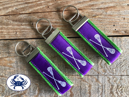 White Lacrosse Sticks on Purple Key Chain