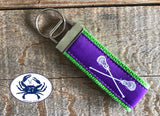 White Lacrosse Sticks on Purple Key Chain