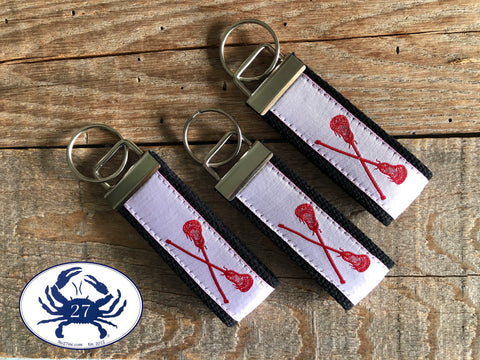 Red Lacrosse Sticks on White Key Chain