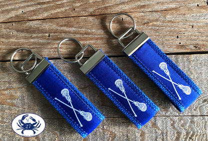 White Lacrosse Sticks on Royal Blue Key Chain
